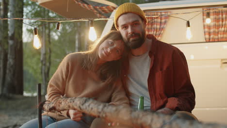 portrait of young romantic couple at campsite