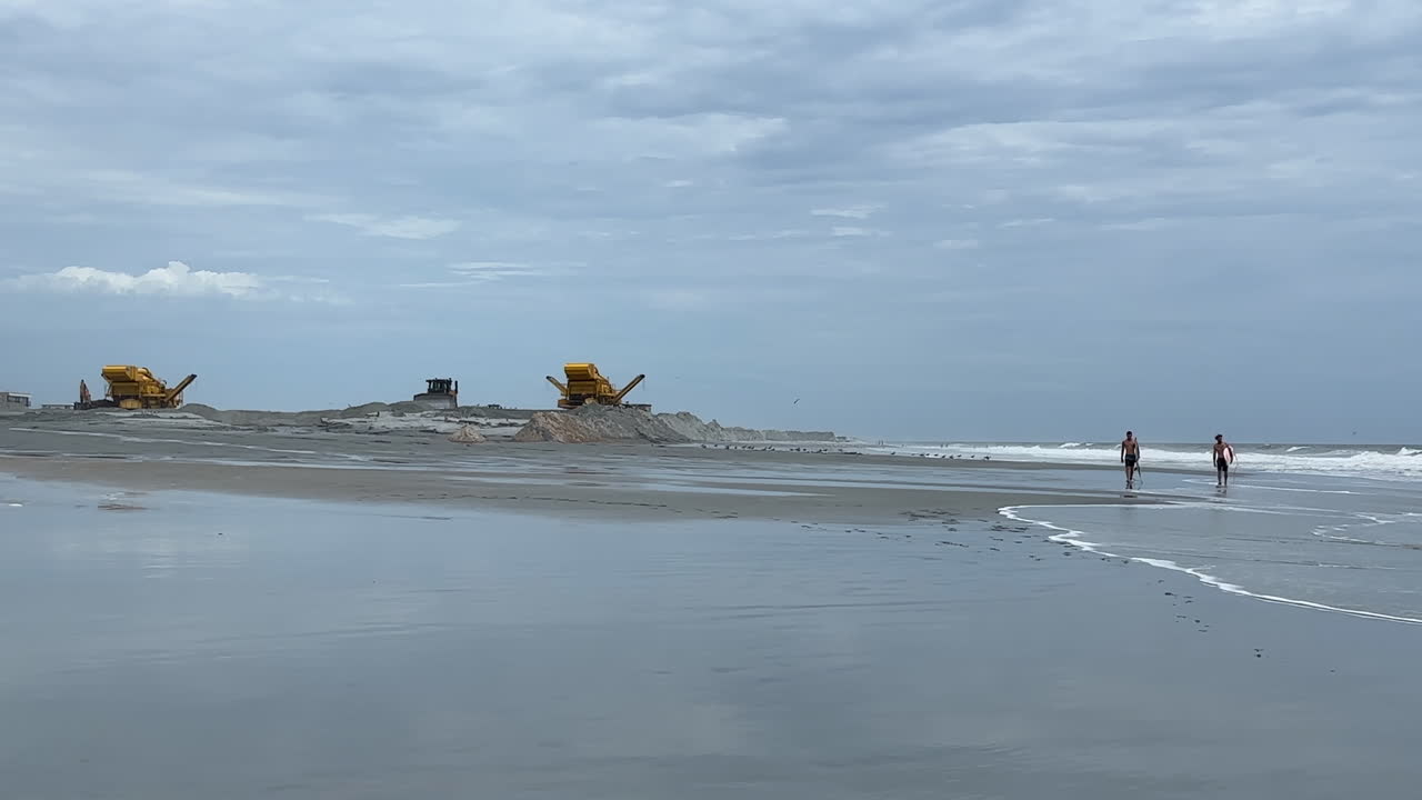 Beach Construction and a Person Walking