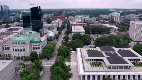 Drone-shot-of-downtown-Raleigh-with-the-state-legislature-building-in-the-foreground