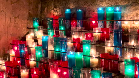 hundreds of candles lit in prayer
