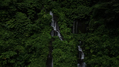 lots of small waterfalls in the north of bali in the jungle, aerial