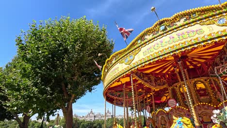 carousel spinning under a clear blue sky