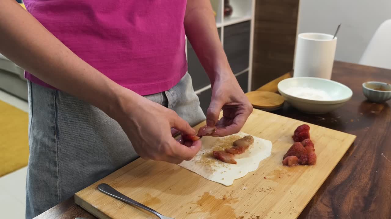 Preparing strawberry pastries
