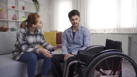 Disabled-man-in-wheelchair-and-his-girlfriend-talking.