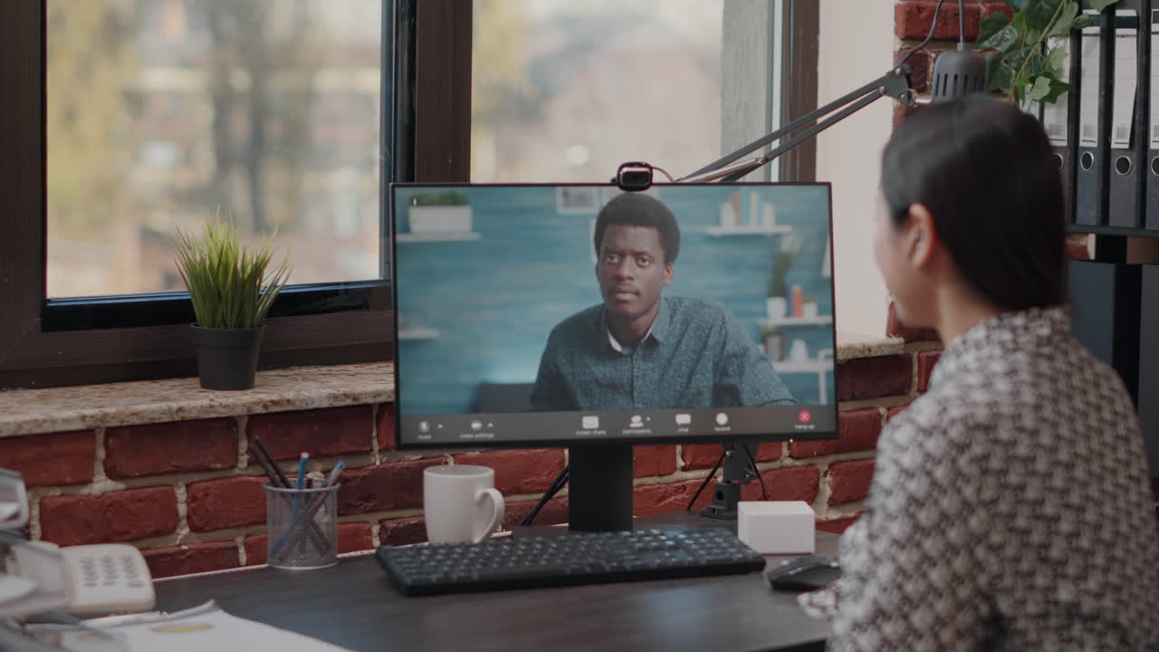 Handheld shot of woman talking to man on video call