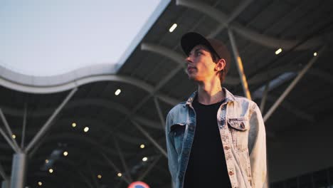 cinematic portrait of young hipster man on urban background