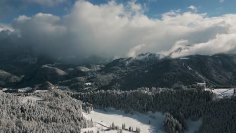 snowy landscape with snow, sunlight and blue sky in mountain ridge