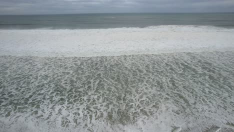 Sea-waves-on-deserted-beach-in-sunny-day