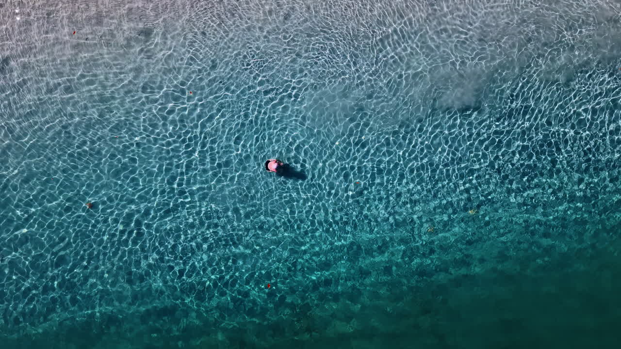Top Down View Of Tourist Swimming In Turquoise Ocean In Bocas del Toro, Panama - Drone Shot