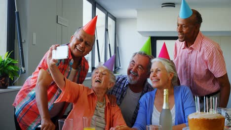 happy senior friends taking selfie with mobile phone 4k