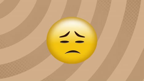 digital animation of sad face emoji against spinning spirals on brown background