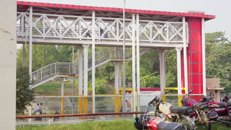 a city metro bus station with passengers walking along its pathway to board the bus showcases a scenic infrastructure.