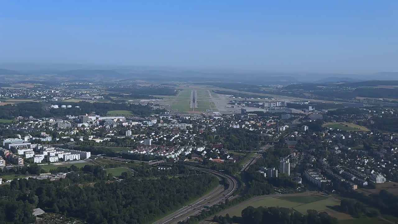 A Pilot vew of a real time approach to Zurich airport in a hazy summer morning. 4K