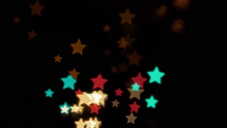 beautiful star bokeh from moving car and traffic lights at the evening, christmas, winter, holiday or glamour party background concept, copyspace