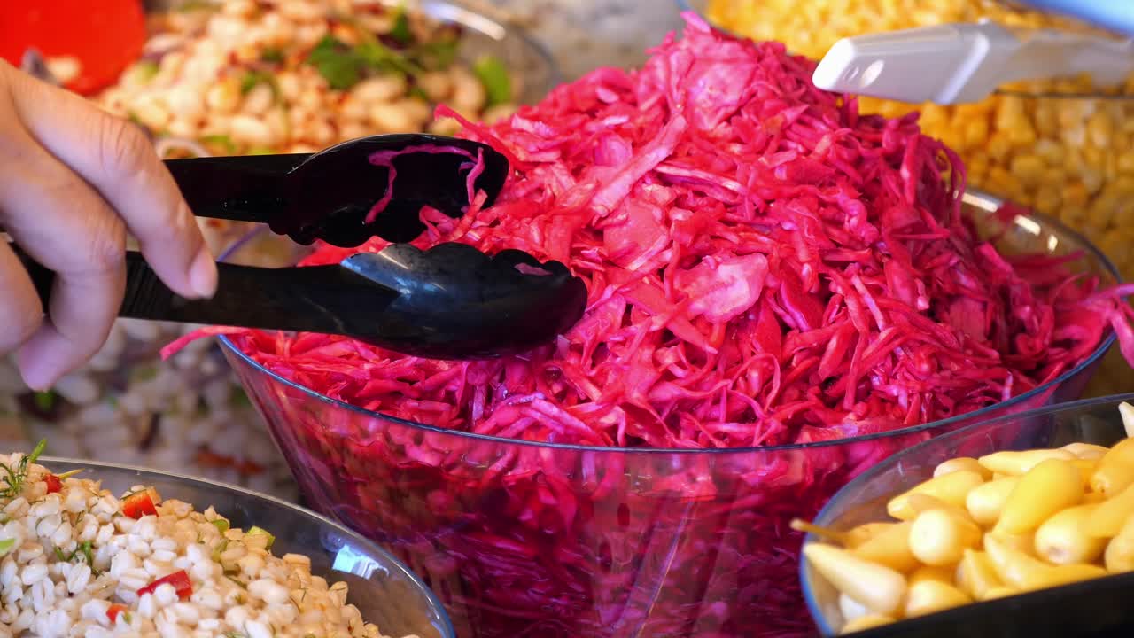Selection of salads including red cabbage salad