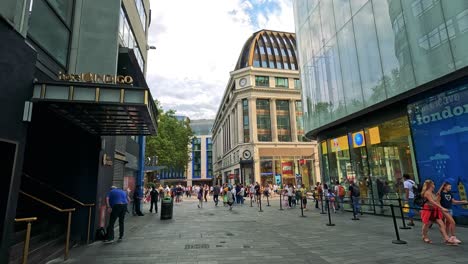 people walking and shopping in urban london