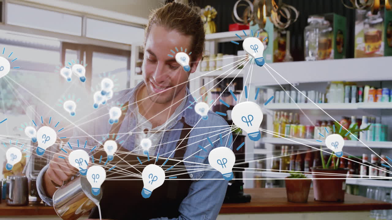 Barista creating latte art into coffee cup in hospitality space, with lightbulb icons overlay