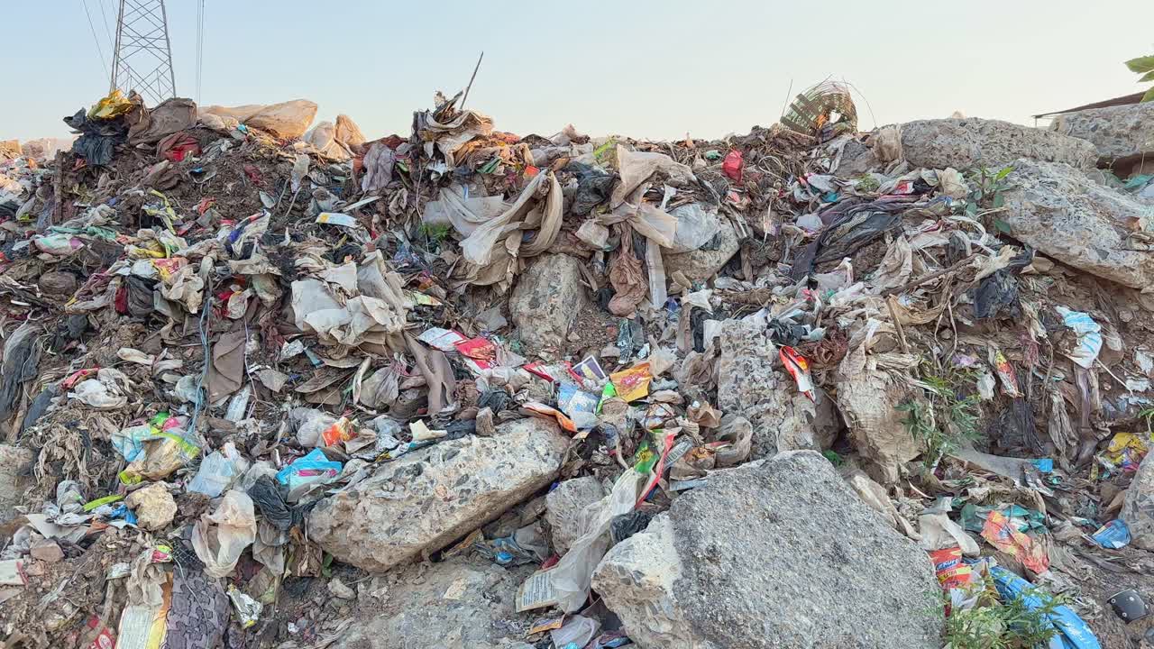 tilt up shot revealing a dump yard