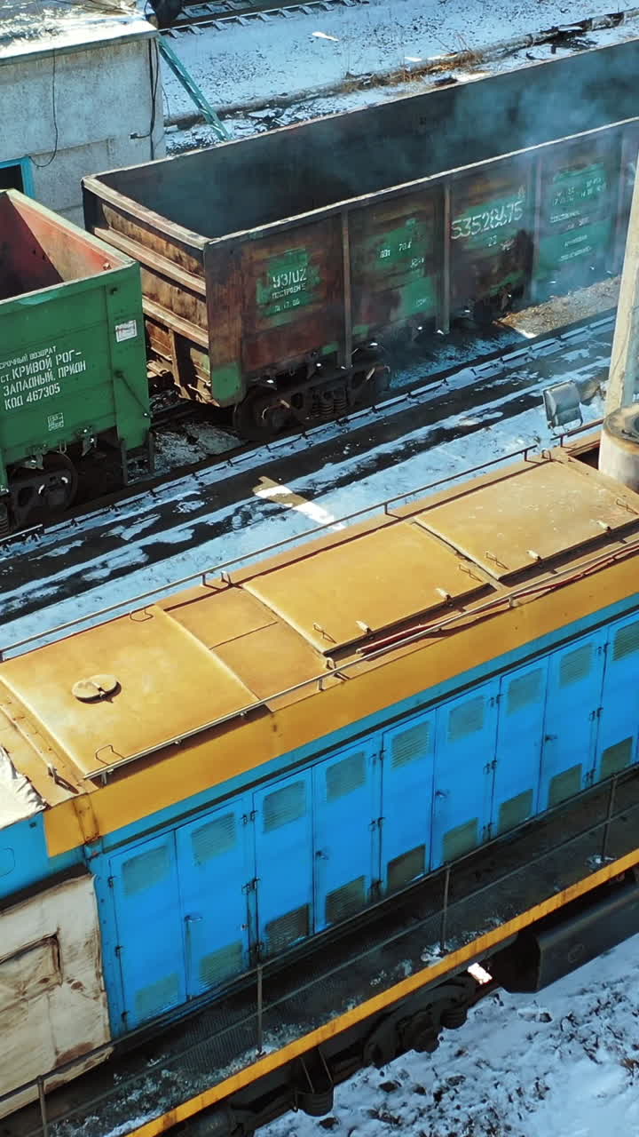Container trains logistic industry. Aerial view of freight trains on city cargo terminal. Vertical video