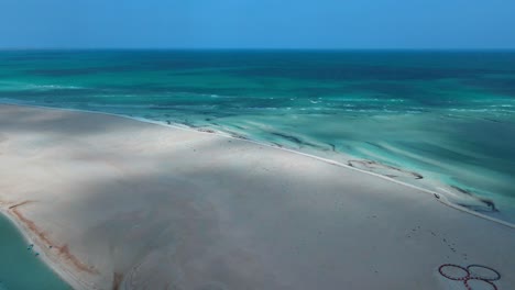 An-aerial-view-of-Hassi-El-Jerbi-aquatic-beach-scene-at-Zarzis-Tunisia-and-rivers-surrounding-it-while-camera-panning