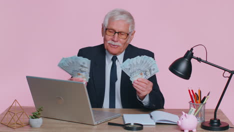 Business-office-man-accountant-celebrating-business-success-dancing-with-stack-of-money-dollar-cash