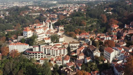 aerial tracking and tilt shot of the national palace of sintra outside of lisbon, portugal