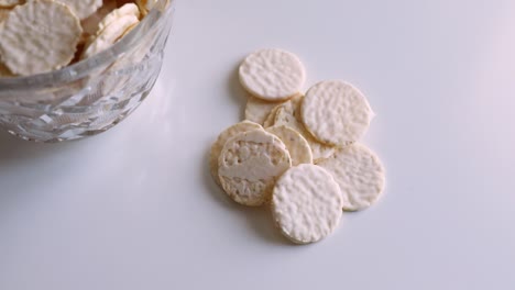 round cookies in white chocolate on a white table. sweet morning.