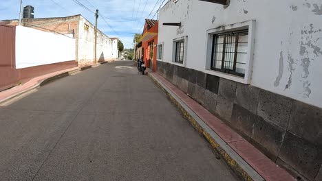casual walk along a colonial pathway in a busy mexican village