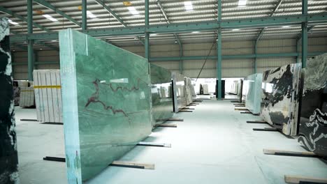 gimbal shot of polished granite and marble slabs in a modern warehouse, highlighting premium textures, vibrant colors, and durability for luxury interiors and architecture