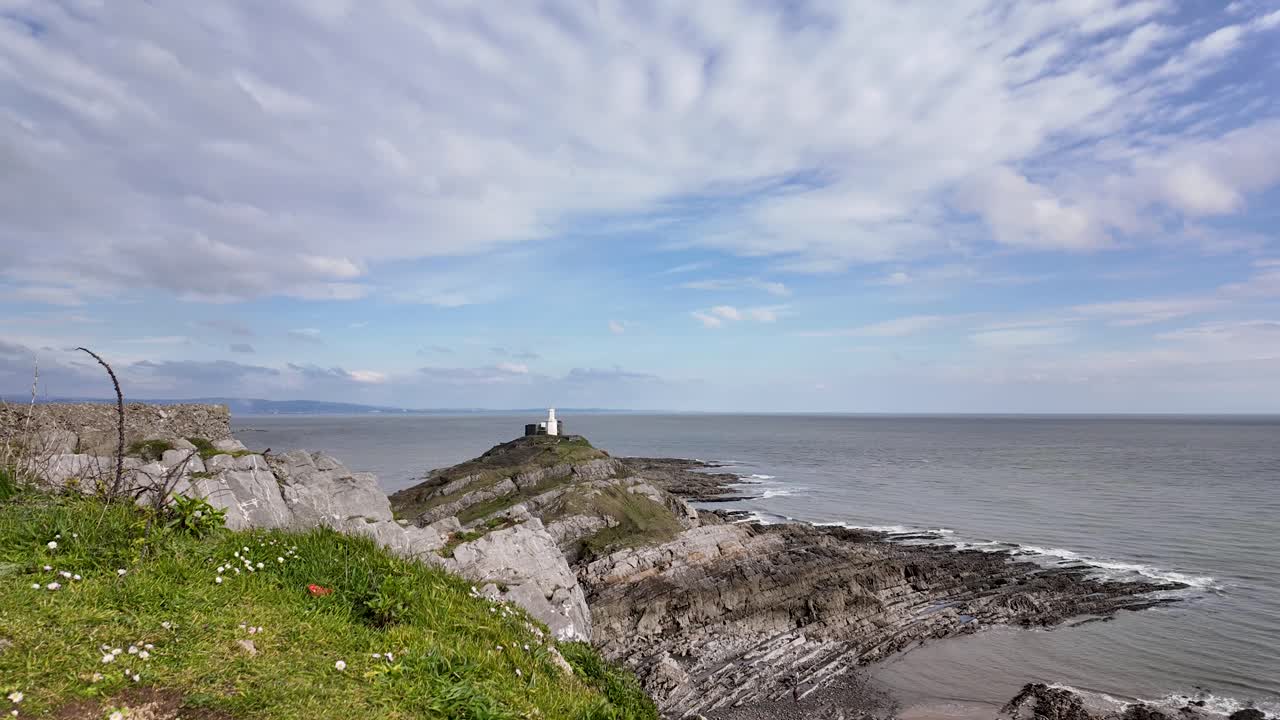 Strumble Head Lighthouse Over Rocky Head Near Fishguard In Northern Pembrokeshire, Wales, United Kingdom. Timelapse