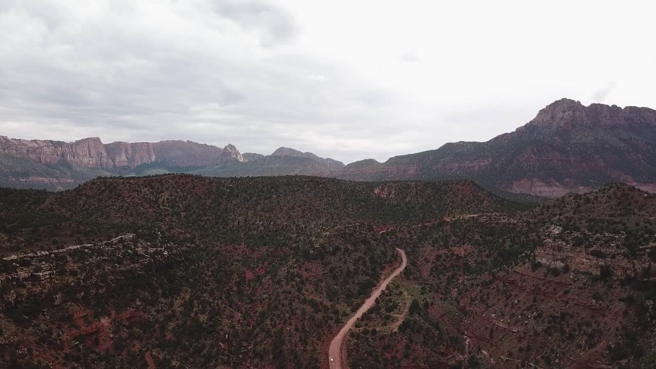 Drone Aerial View on Hills and Mountains in Zion National Park Utah USA Under Cloudy Sky
