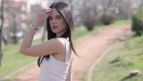 Girl-posing-for-a-photo-in-a-park