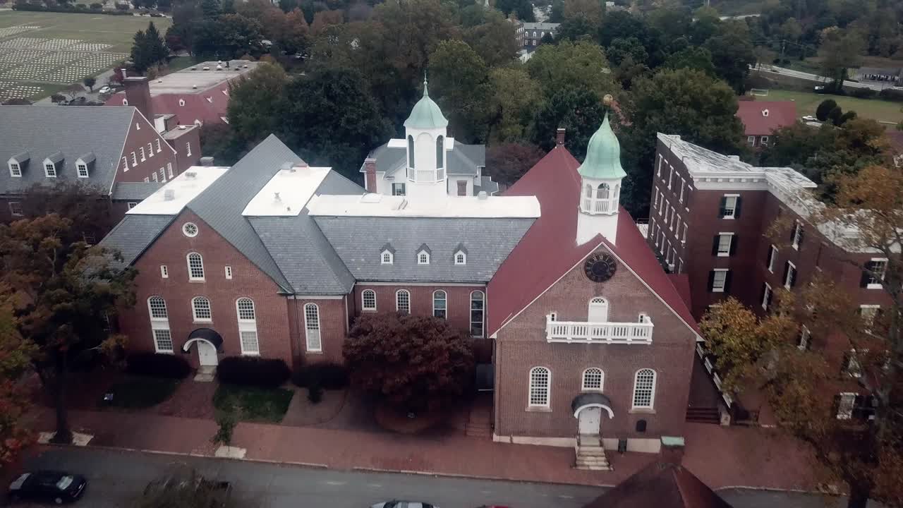 Aerial Push into Home Moravian Church in Old Salem in Fall in 4k