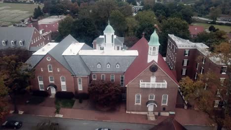 aerial push into home moravian church in old salem in fall in 4k