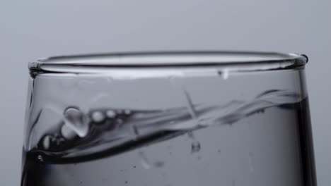 water in a glass with droplets