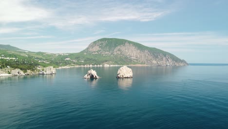 gurzuf, crimea - aerial panoramic view on gurzuf bay with bear mountain ayu-dag and rocks adalary, artek - oldest children vacation camp. yalta region, the south coast of crimea peninsula