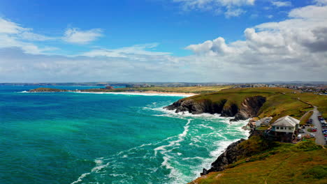 aerial drone shot over the picturesque rocky coastline in cornwall, united kingdom