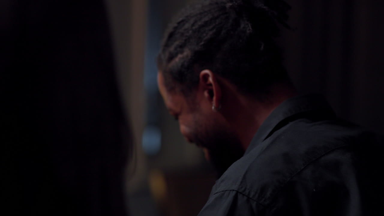 Man with beard eating indoors