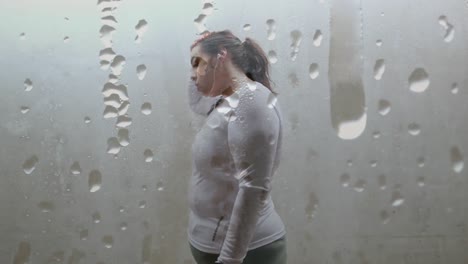 animation of drops of rain over plus size caucasian woman exercising in city