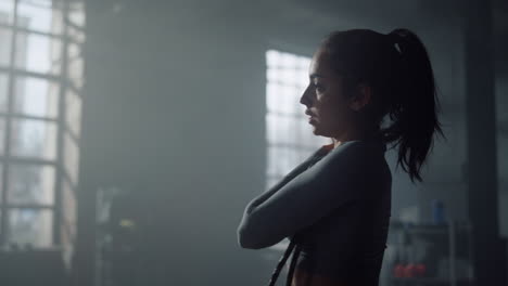 woman in sportswear preparing body for exercising. girl moving shoulder