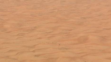 desert dunes seen from the sky in sideway flight