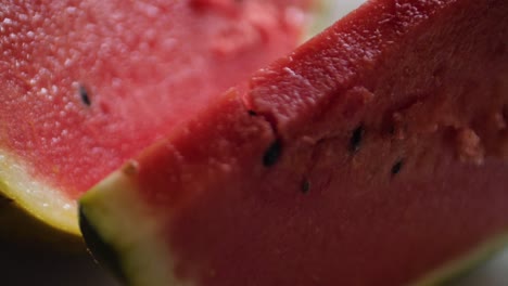 Macro-dolly-shot-of-a-freshly-sliced-piece-of-watermelon-in-a-kitchen