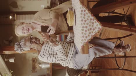 two elderly women sharing a moment with a smartphone