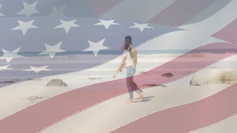 Animation-of-american-flag-moving-over-couple-holding-hands-and-walking-on-beach