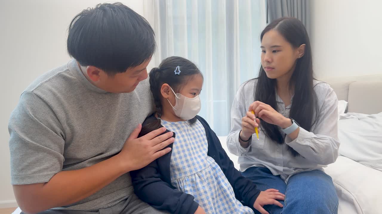 Parents attentively care for their sick daughter on a bed, creating a warm, nurturing environment with soft lighting and gentle interactions