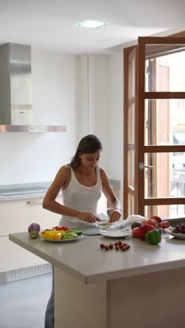 woman preparing a healthy salad in the kitchen