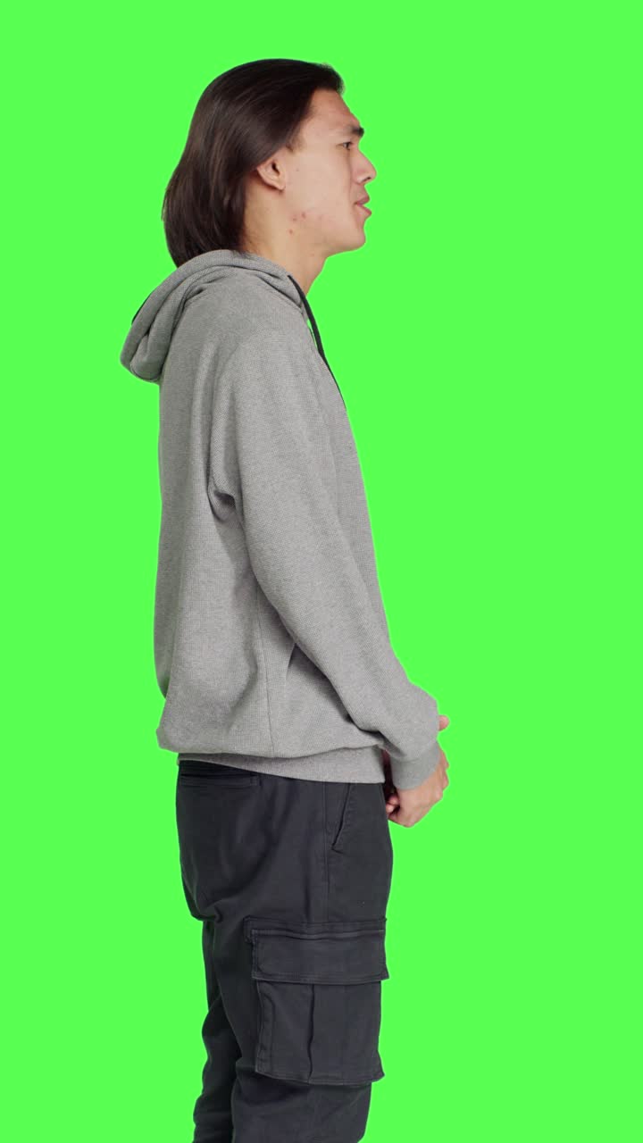 Profile of young guy doing no gesture in studio