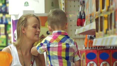 mother and son in toy shop