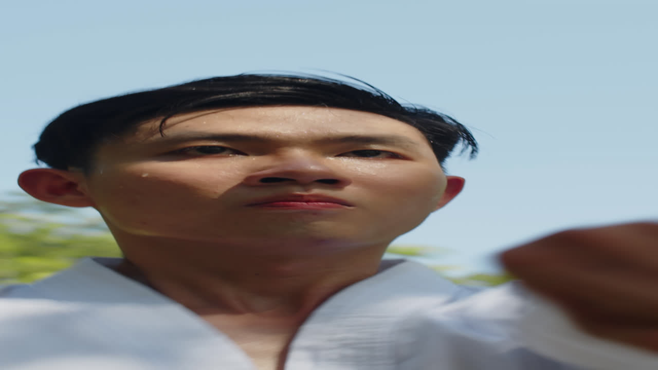 Male Asian Athlete Performing Jab Punches