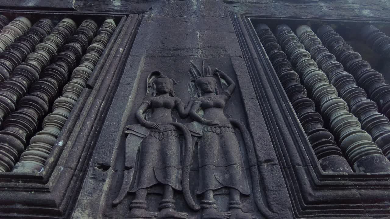 Angkor Wat Apsara Dancers Bas-reliefs. UNESCO World Heritage Site Near Siem Reap, Cambodia. Low Angle Shot